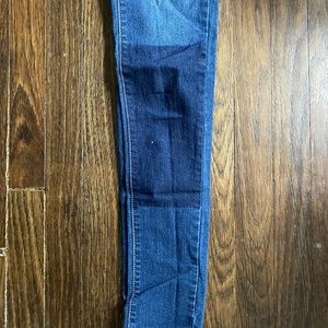 Medium wash denim, with dark patch knee.
